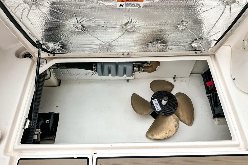  Yacht Photos Pics 2022 Cutwater 30 Command Bridge engine compartment with propeller and insulation.