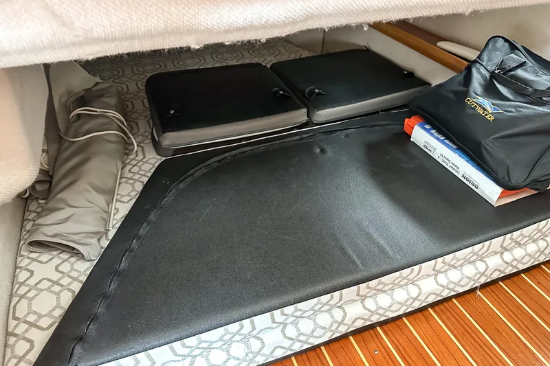  Yacht Photos Pics 2022 Cutwater 30 Command Bridge interior storage with cushions and accessories.