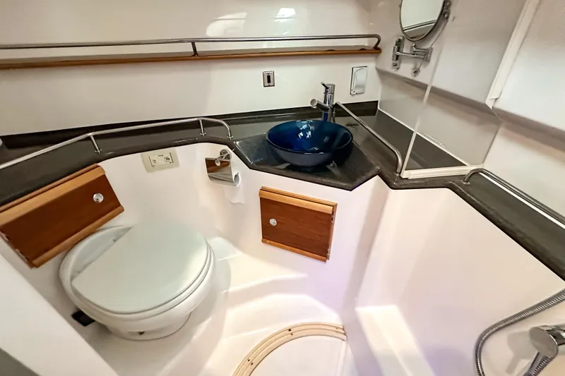  Yacht Photos Pics 2022 Cutwater 30 Command Bridge bathroom with modern sink and toilet.