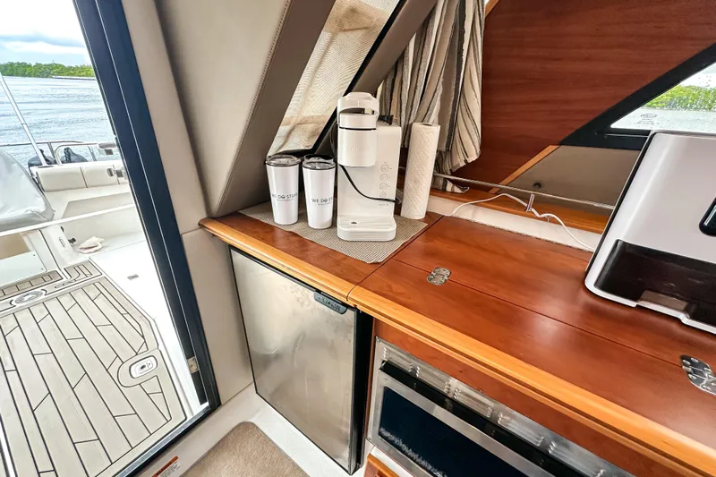  Yacht Photos Pics Interior of 2022 Cutwater 30 Command Bridge with kitchenette and lake view.