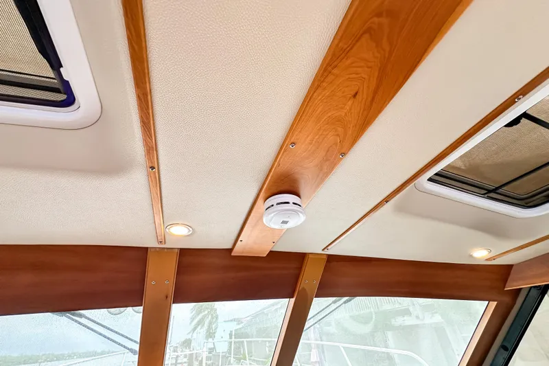 Yacht Photos Pics Interior ceiling of 2022 Cutwater 30 Command Bridge with wood accents and lighting.