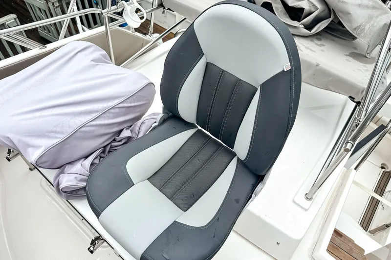  Yacht Photos Pics 2022 Cutwater 30 Command Bridge boat seat, featuring sleek black and gray design.