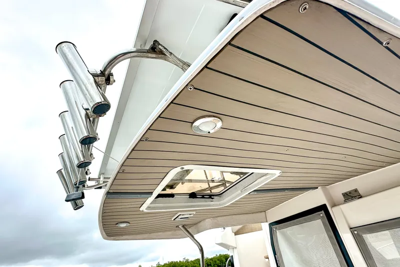  Yacht Photos Pics 2022 Cutwater 30 Command Bridge boat roof with rod holders and hatch.