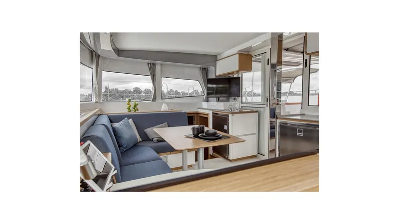  Yacht Photos Pics Luxurious interior of 2020 Excess 12 catamaran with modern seating and dining area.