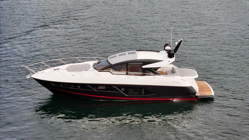 Veni Vici Yacht Photos Pics 2019 Sunseeker Predator 57 yacht on calm water, side view.