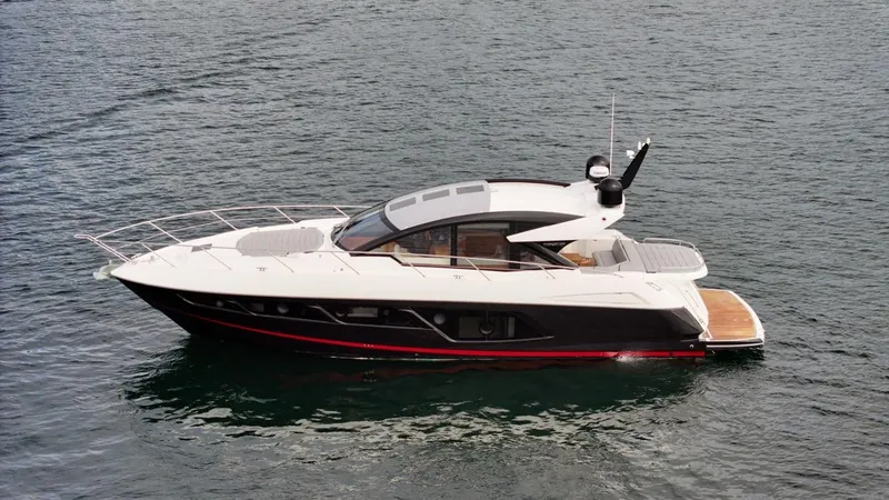 Veni Vici Yacht Photos Pics 2019 Sunseeker Predator 57 yacht on calm water, side view.