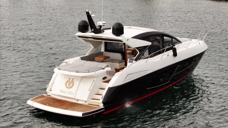 Veni Vici Yacht Photos Pics 2019 Sunseeker Predator 57 yacht cruising on water, rear view.