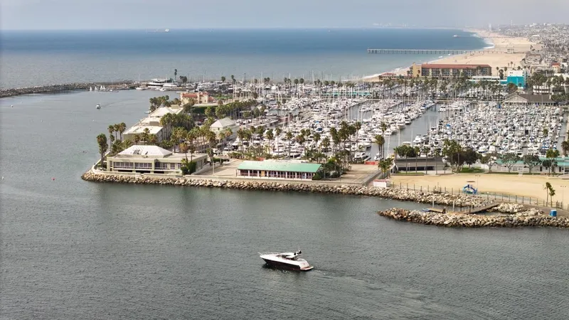 Veni Vici Yacht Photos Pics Aerial view of 2019 Sunseeker Predator 57 yacht near marina and coastline.