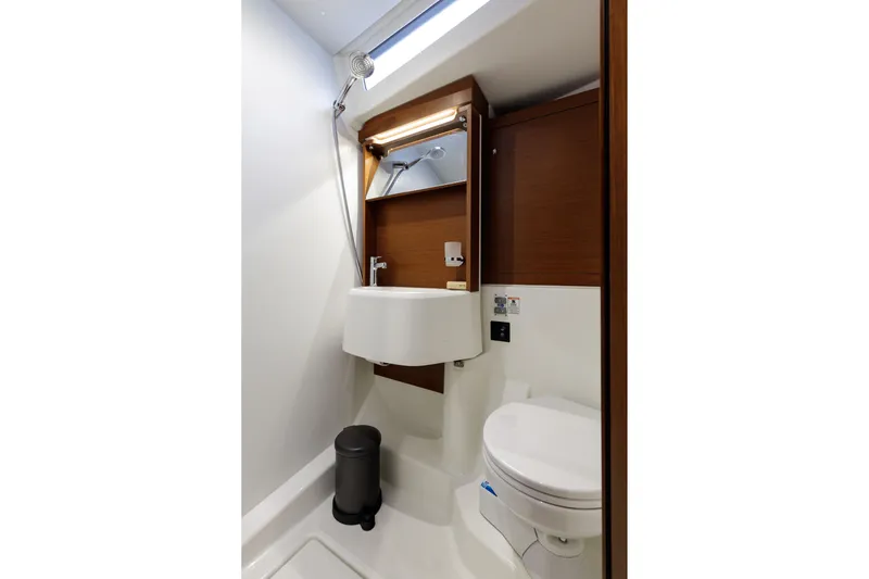  Yacht Photos Pics Modern bathroom in 2019 Beneteau Oceanis 51.1 yacht, featuring sleek design and compact fixtures.