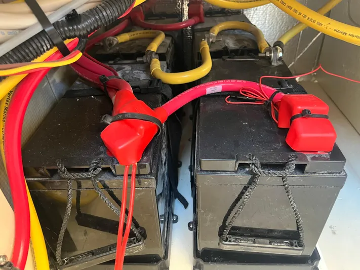 Together Again II Yacht Photos Pics Battery compartment of 2022 Ranger Tugs R-31 CB with red and yellow cables.
