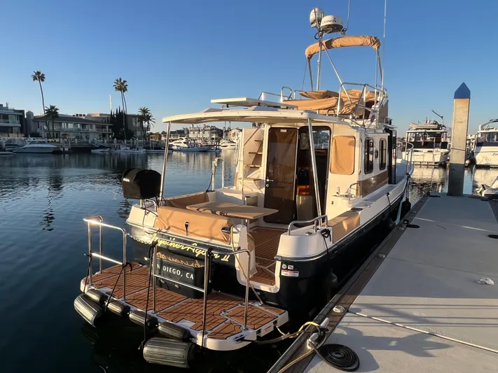 Together Again II Yacht Photos Pics 2022 Ranger Tugs R-31 CB docked in a sunny marina setting.