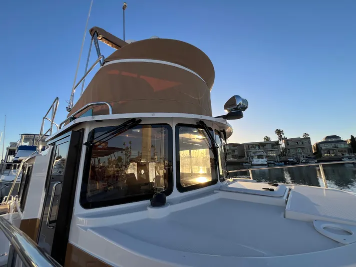 Together Again II Yacht Photos Pics 2022 Ranger Tugs R-31 CB boat docked at sunset, reflecting on water.