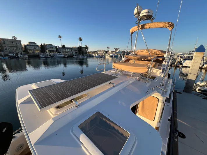 Together Again II Yacht Photos Pics 2022 Ranger Tugs R-31 CB boat with solar panel, docked in a marina.
