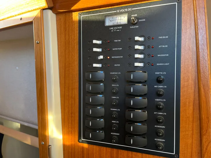 Together Again II Yacht Photos Pics Control panel of 2022 Ranger Tugs R-31 CB boat, featuring switches and voltage display.