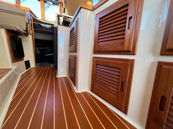 Together Again II Yacht Photos Pics Interior of 2022 Ranger Tugs R-31 CB with wood paneling and flooring.