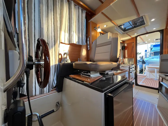 Together Again II Yacht Photos Pics Interior of 2022 Ranger Tugs R-31 CB, featuring helm station and modern amenities.