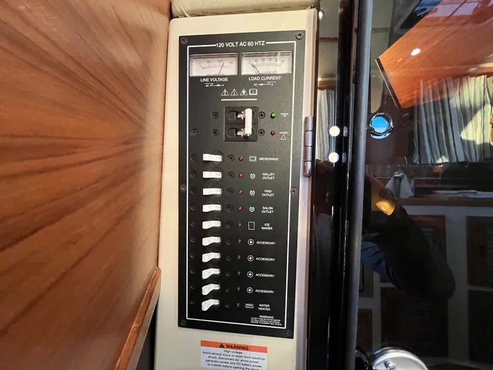 Together Again II Yacht Photos Pics Electrical panel on 2022 Ranger Tugs R-31 CB boat, featuring switches and voltage meters.