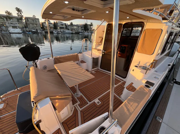 Together Again II Yacht Photos Pics 2022 Ranger Tugs R-31 CB boat with spacious deck and seating, docked at sunset.