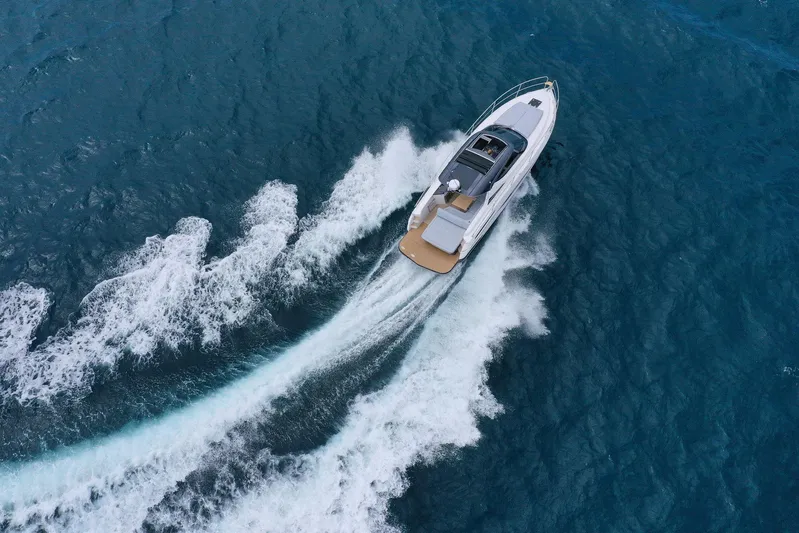  Yacht Photos Pics Aerial view of 2025 Focus Power 36 yacht cruising on blue ocean waters.