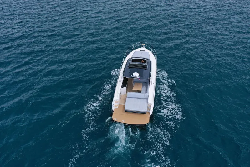  Yacht Photos Pics 2025 Focus Power 36 boat cruising on open blue water.