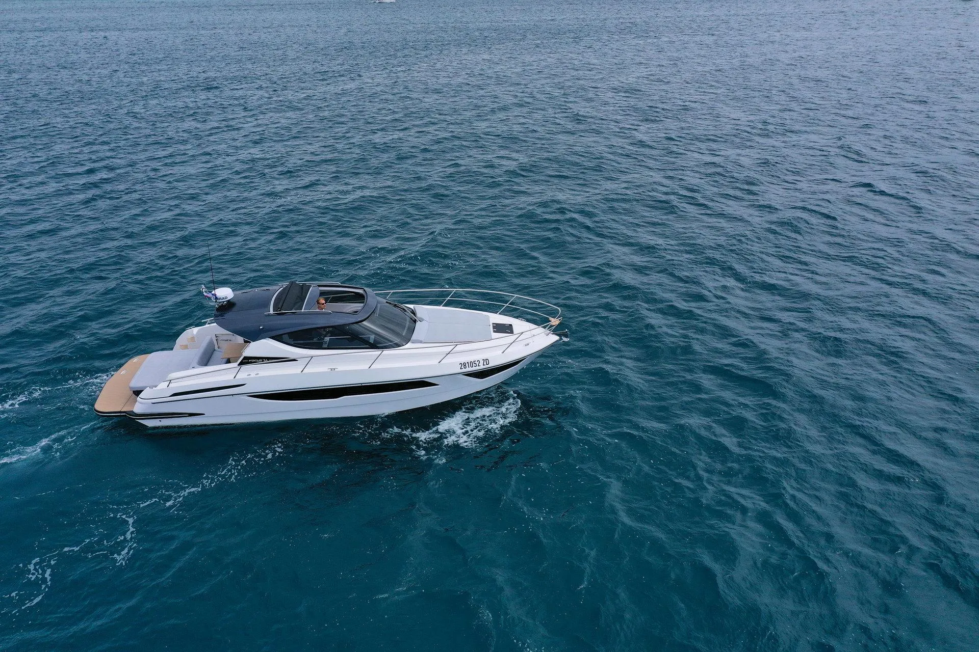 2025 Focus Power 36 yacht cruising on open blue sea.