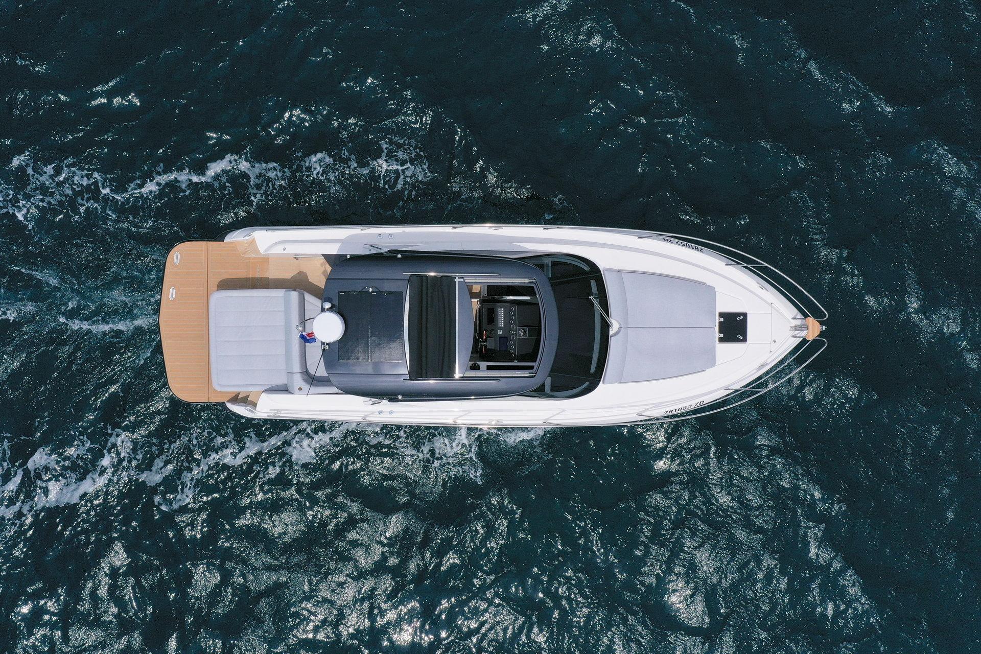 Aerial view of 2025 Focus Power 36 yacht cruising on the ocean.