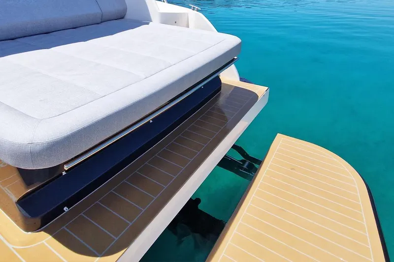  Yacht Photos Pics Luxury seating on a 2025 Focus Power 36 yacht, overlooking clear blue water.