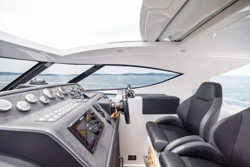  Yacht Photos Pics Interior of 2025 Focus Power 36 yacht with modern dashboard and leather seating.