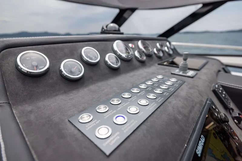  Yacht Photos Pics Control panel of 2025 Focus Power 36 boat with gauges and buttons, overlooking the sea.