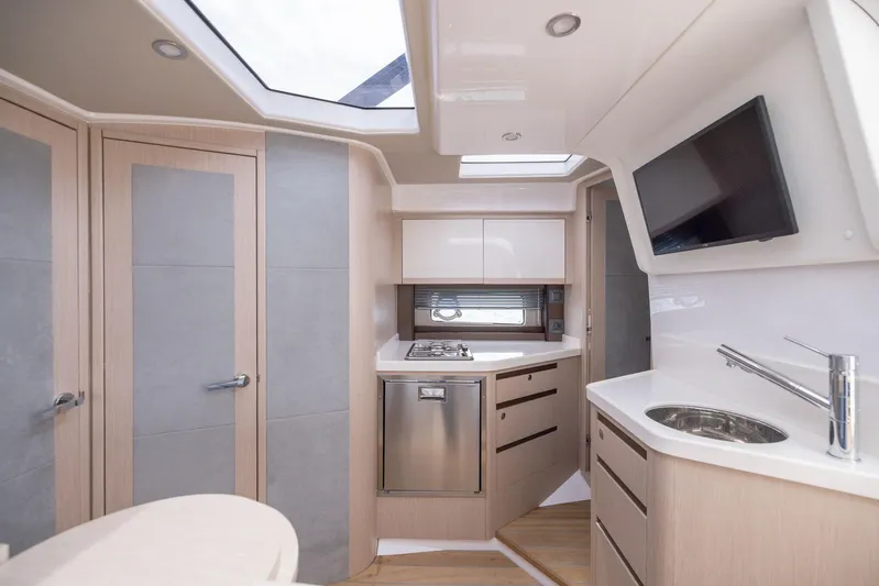  Yacht Photos Pics Modern kitchen interior of 2025 Focus Power 36 yacht with sleek design and appliances.