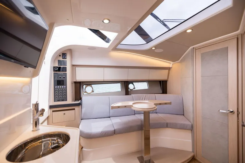  Yacht Photos Pics Luxurious interior of 2025 Focus Power 36 yacht with modern seating and skylight.