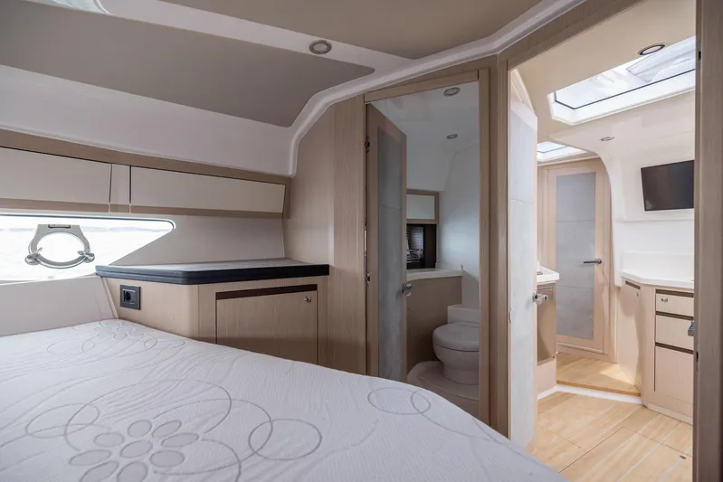  Yacht Photos Pics Luxurious interior of 2025 Focus Power 36 yacht with bedroom and bathroom.