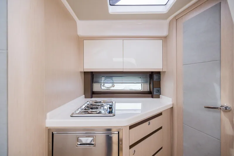  Yacht Photos Pics Modern kitchen interior of 2025 Focus Power 36 yacht with stove and cabinetry.