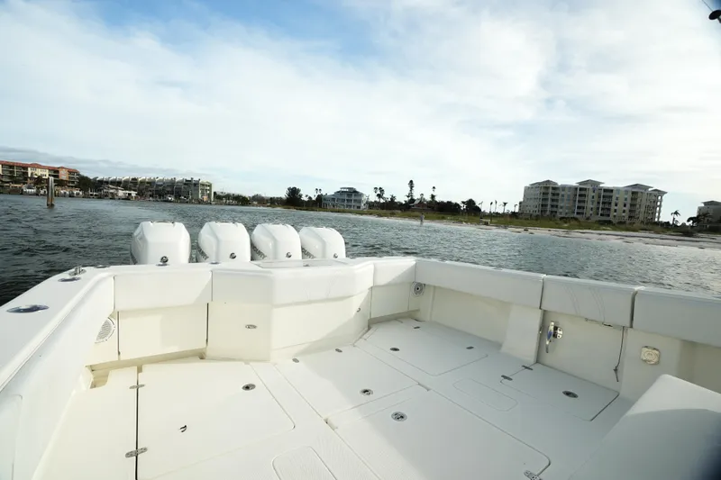  Yacht Photos Pics 2013 SeaVee 390B boat deck with quad engines, coastal view in background.