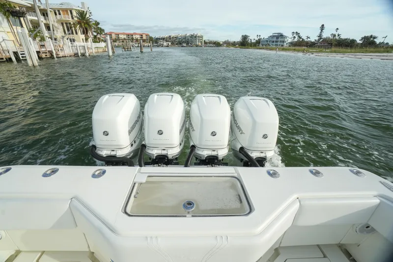  Yacht Photos Pics 2013 SeaVee 390B boat with four powerful outboard engines on the water.