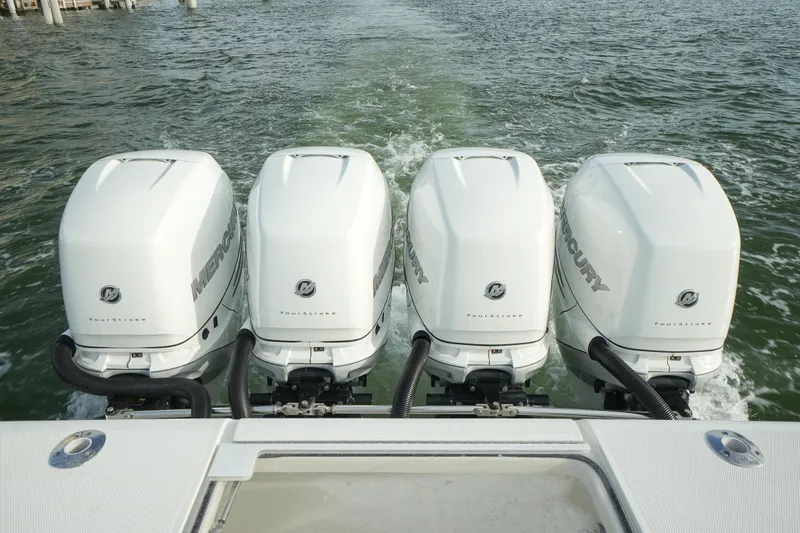  Yacht Photos Pics Four Mercury outboard engines on a 2013 SeaVee 390B boat in water.