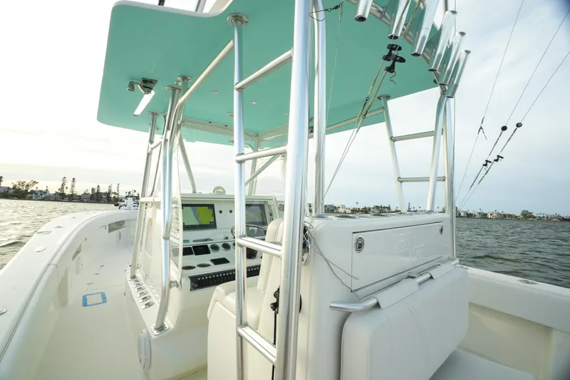  Yacht Photos Pics 2013 SeaVee 390B boat interior with helm, rod holders, and navigation equipment.