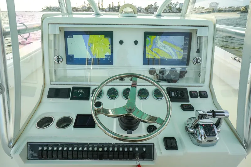  Yacht Photos Pics 2013 SeaVee 390B boat dashboard with dual navigation screens and steering wheel.