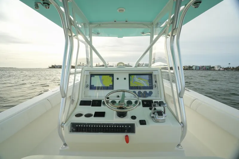  Yacht Photos Pics 2013 SeaVee 390B boat dashboard with navigation screens on open water.