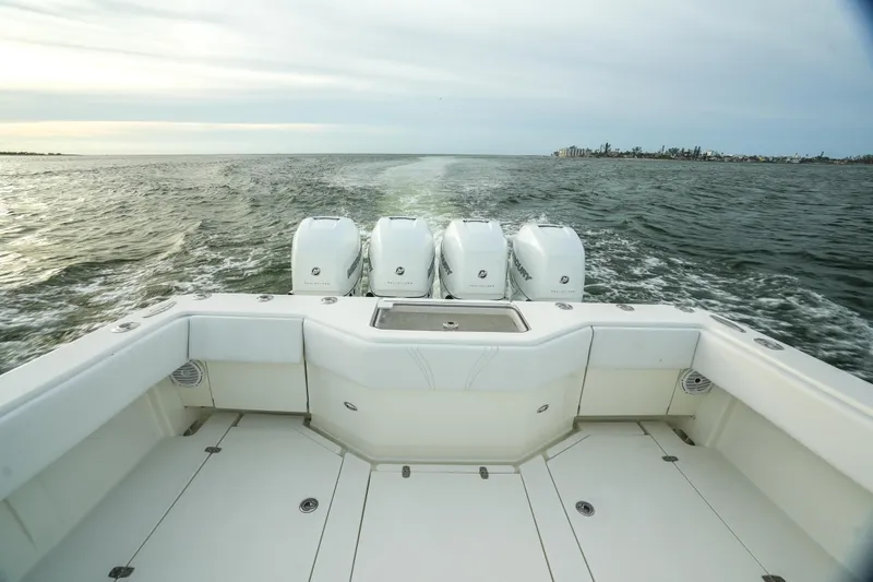  Yacht Photos Pics 2013 SeaVee 390B boat with four engines cruising on open water.