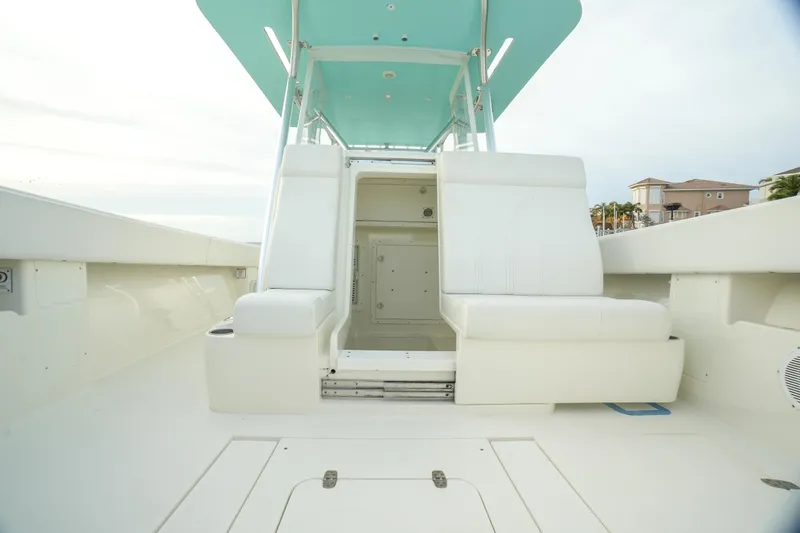  Yacht Photos Pics 2013 SeaVee 390B boat interior with white seating and teal canopy.