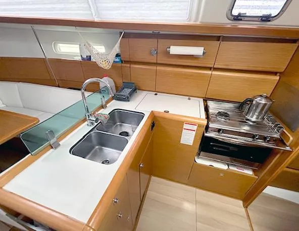 Escape Yacht Photos Pics 2018 Jeanneau Sun Odyssey 389 yacht kitchen with dual sinks and stove.