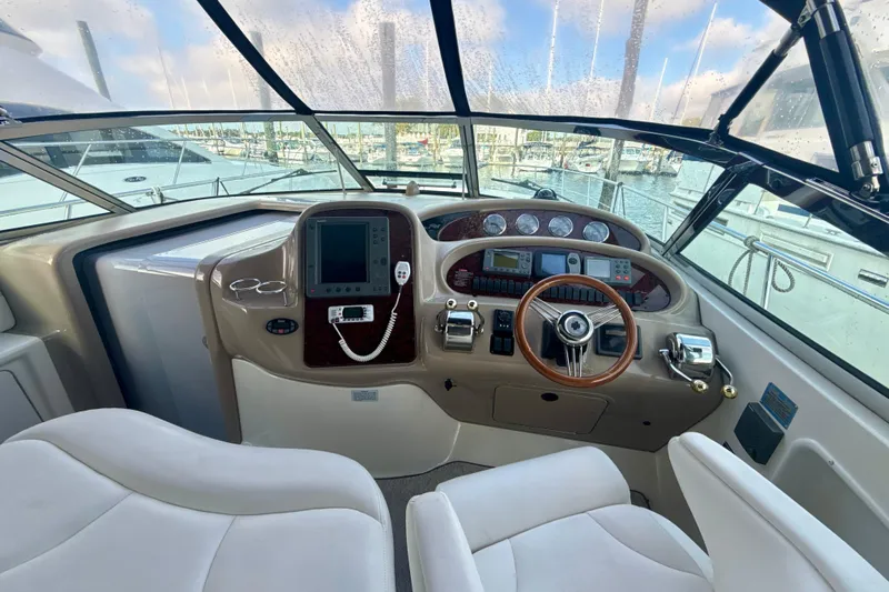 Off The Air Yacht Photos Pics Helm of 2004 Sea Ray 380 Sundancer with modern controls and panoramic view.