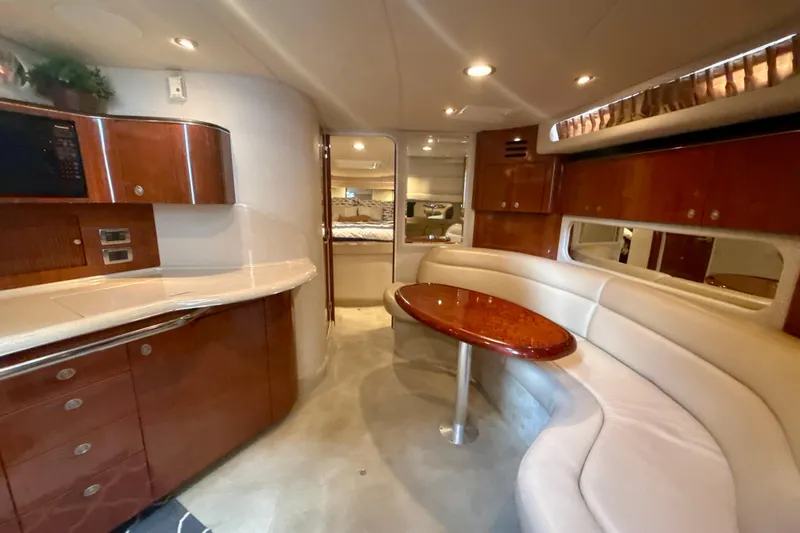 Off The Air Yacht Photos Pics Luxurious interior of 2004 Sea Ray 380 Sundancer yacht with elegant seating and cabinetry.