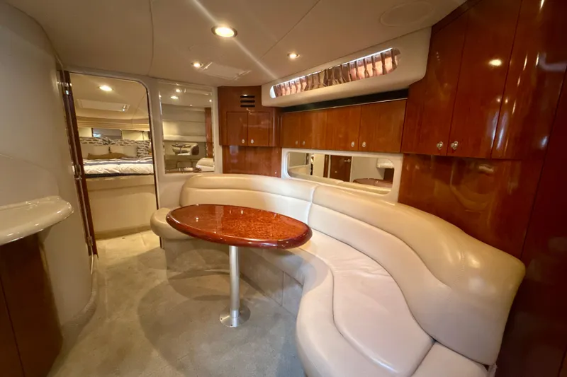 Off The Air Yacht Photos Pics Luxurious interior of 2004 Sea Ray 380 Sundancer yacht with elegant seating and wood finishes.