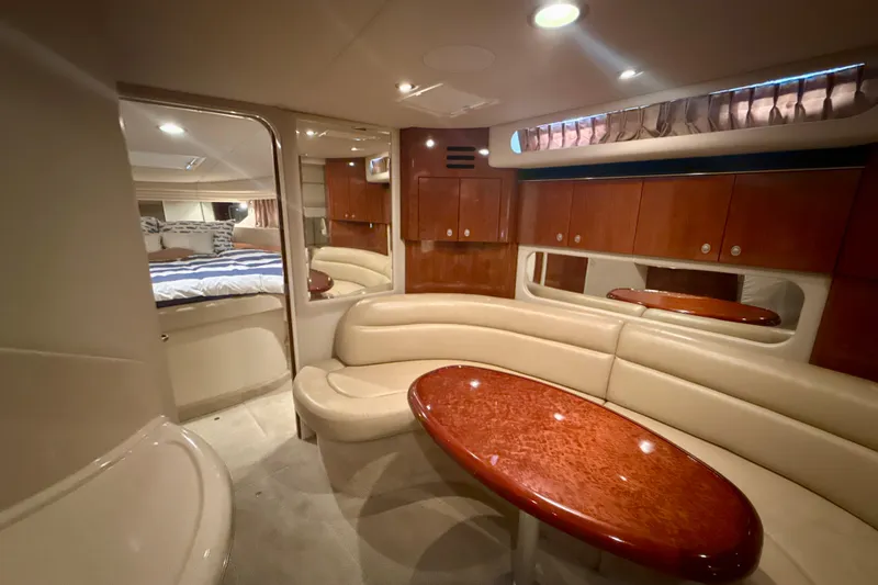 Off The Air Yacht Photos Pics Luxurious interior of 2004 Sea Ray 380 Sundancer yacht with elegant seating and wood finishes.