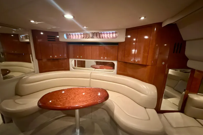 Off The Air Yacht Photos Pics Luxurious interior of 2004 Sea Ray 380 Sundancer with elegant seating and wooden cabinetry.
