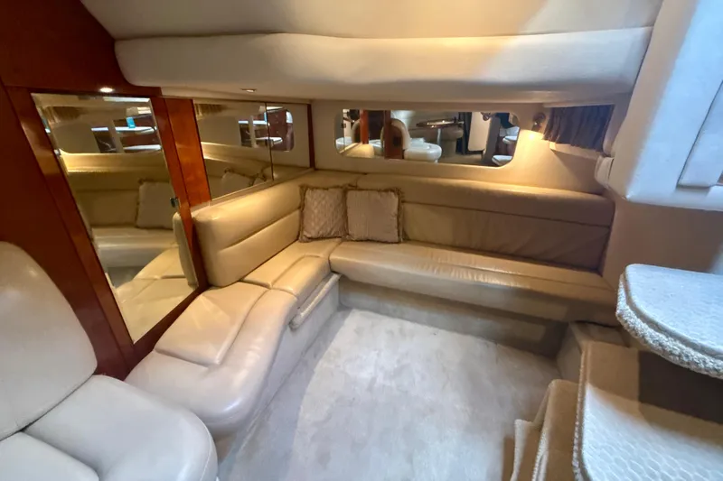 Off The Air Yacht Photos Pics Luxurious interior of 2004 Sea Ray 380 Sundancer yacht with plush seating and elegant design.