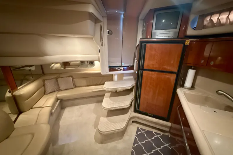 Off The Air Yacht Photos Pics Luxurious interior of 2004 Sea Ray 380 Sundancer yacht with plush seating and modern amenities.