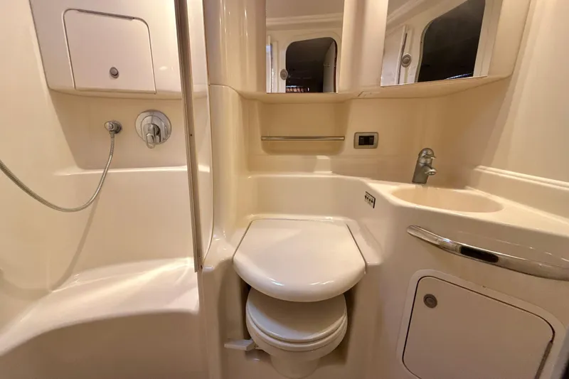 Off The Air Yacht Photos Pics Bathroom interior of 2004 Sea Ray 380 Sundancer yacht, featuring shower and toilet.